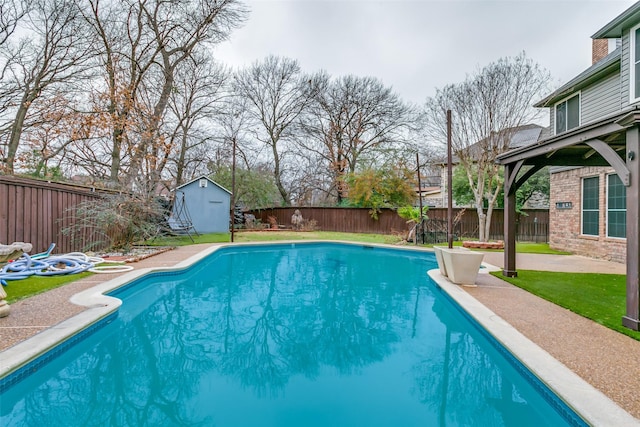 view of swimming pool with a storage unit