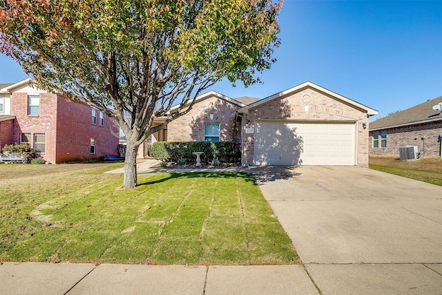 single story home featuring a garage, central air condition unit, and a front lawn