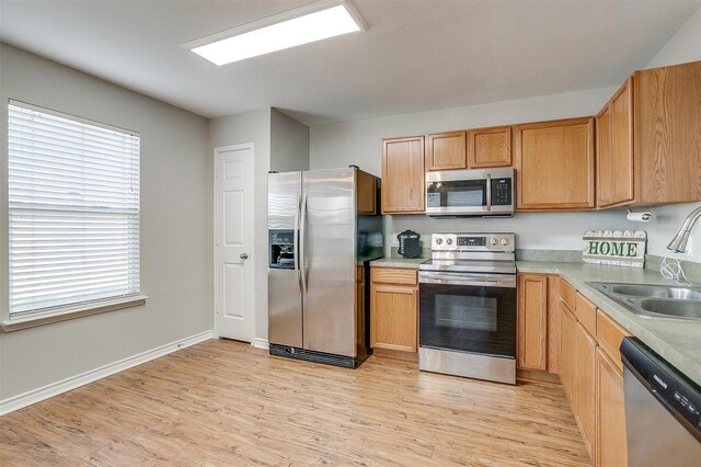 spare room with ceiling fan and light hardwood / wood-style flooring