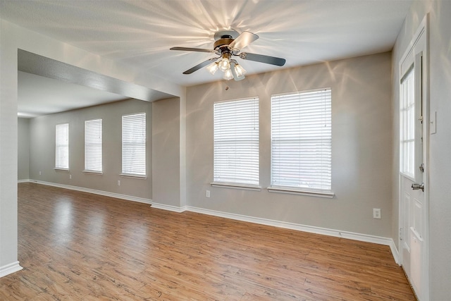 interior space with ceiling fan and light hardwood / wood-style flooring