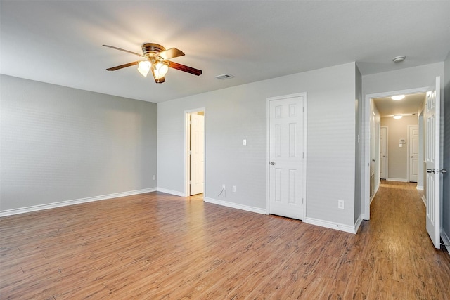 spare room featuring ceiling fan and light wood-type flooring