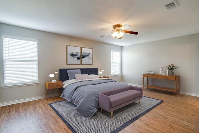 kitchen with ceiling fan, light hardwood / wood-style floors, dishwasher, and sink