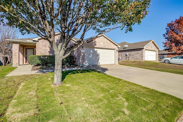 single story home featuring a garage and a front lawn