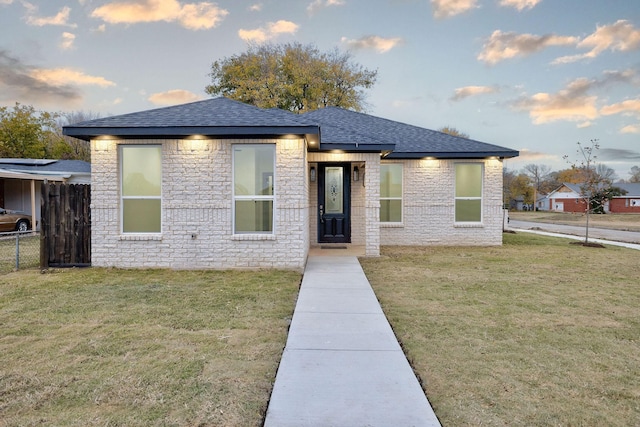 prairie-style house with a lawn