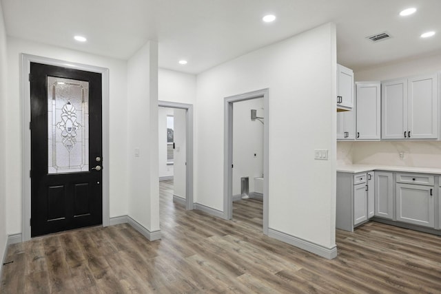 entrance foyer featuring dark hardwood / wood-style floors