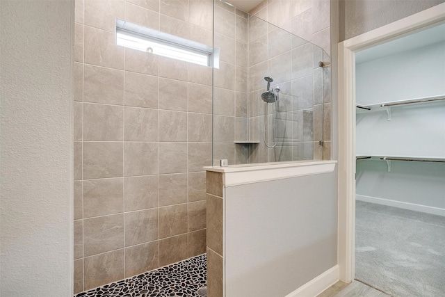 bathroom featuring tiled shower