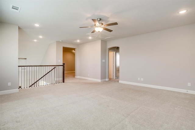 unfurnished room with ceiling fan and light colored carpet