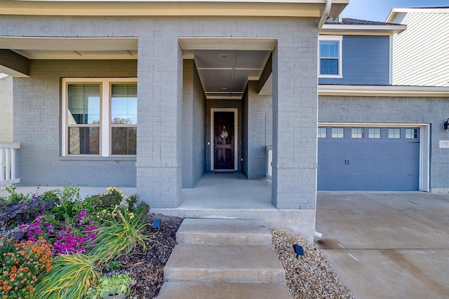 doorway to property with a garage