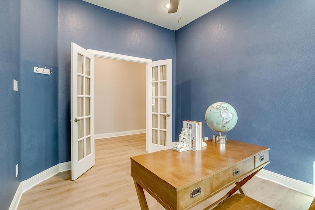 home office featuring ceiling fan, french doors, and light hardwood / wood-style flooring