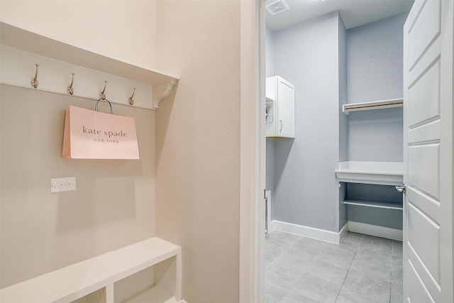 mudroom with light tile patterned flooring