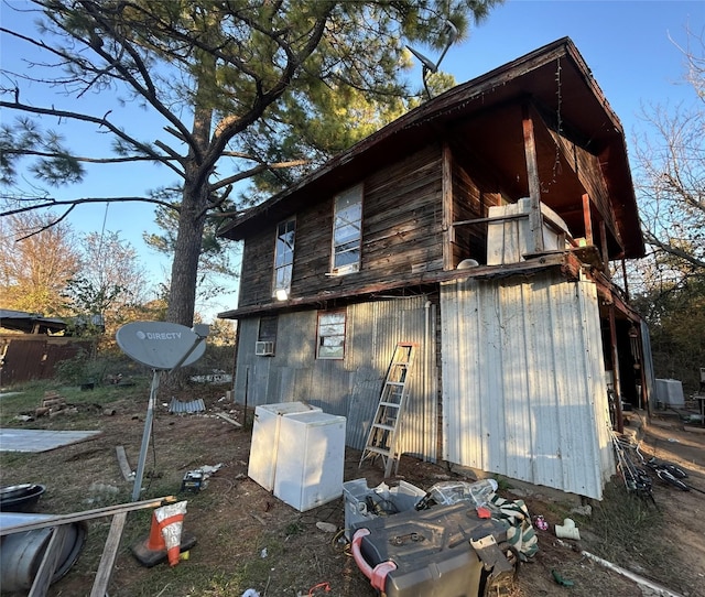 view of home's exterior featuring an outdoor structure