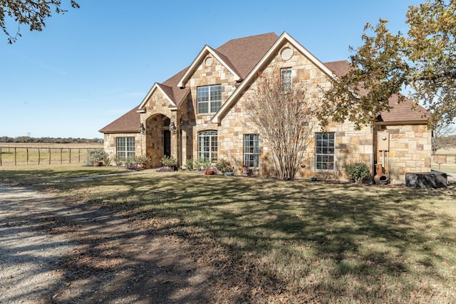 view of front of property with a front lawn