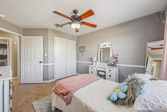 carpeted bedroom with a closet and ceiling fan