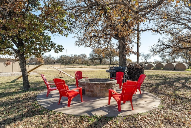 view of patio featuring an outdoor fire pit