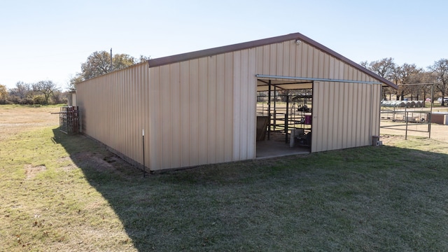 view of outdoor structure featuring a lawn