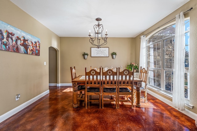 dining space with an inviting chandelier