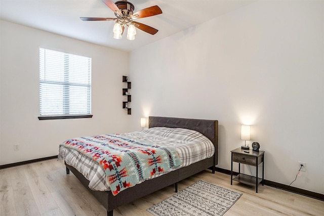 bedroom featuring ceiling fan and light hardwood / wood-style floors