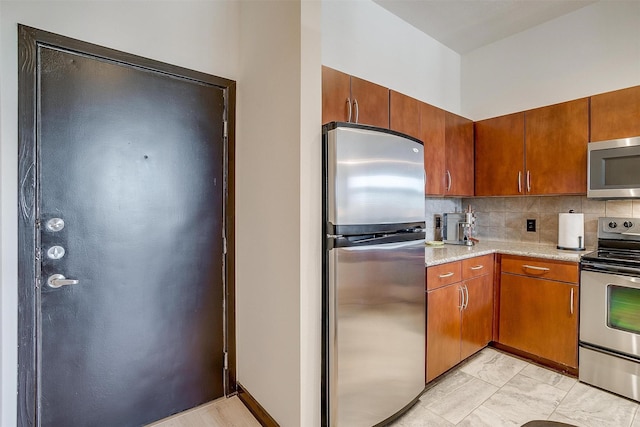 kitchen featuring decorative backsplash and stainless steel appliances