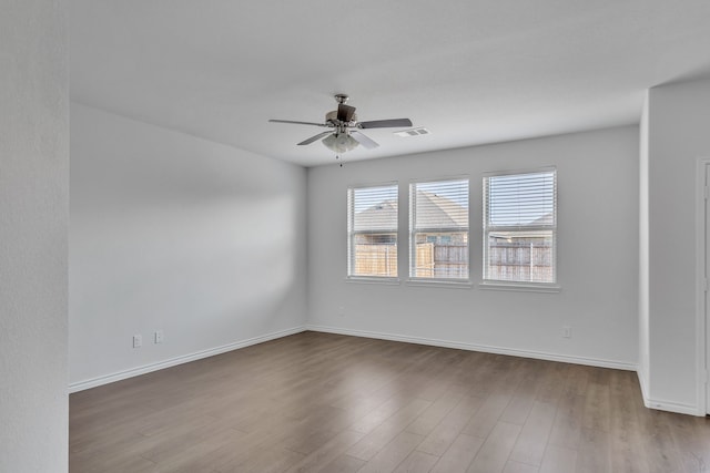 unfurnished room featuring ceiling fan and light hardwood / wood-style flooring