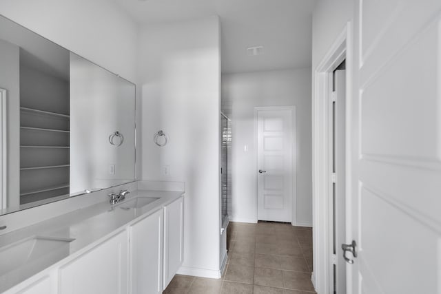 bathroom featuring tile patterned floors and vanity