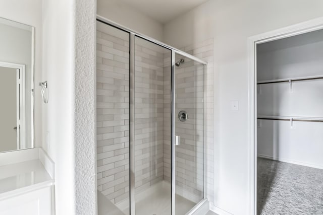 bathroom featuring an enclosed shower