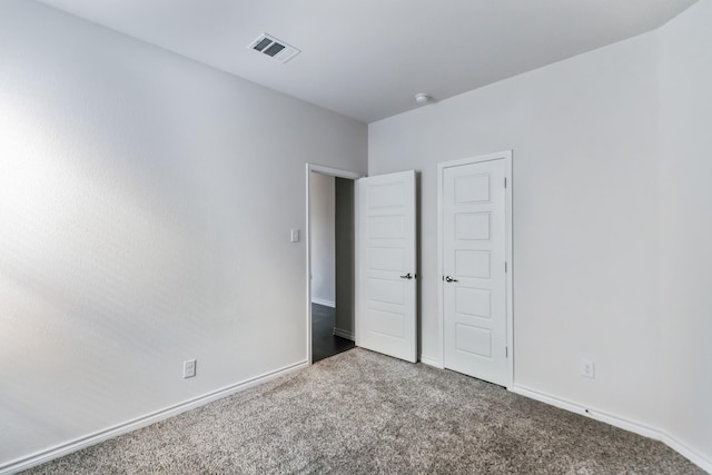 unfurnished bedroom featuring carpet