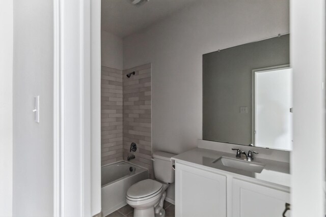 full bathroom featuring tile patterned flooring, tiled shower / bath combo, toilet, and vanity