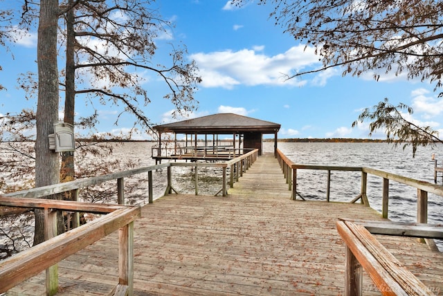 dock area featuring a gazebo and a water view