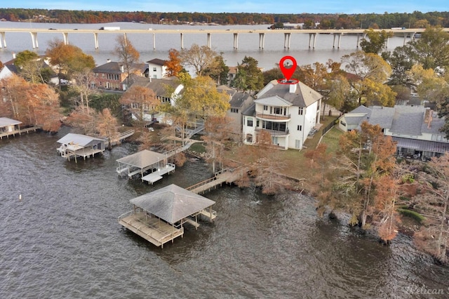 birds eye view of property with a water view