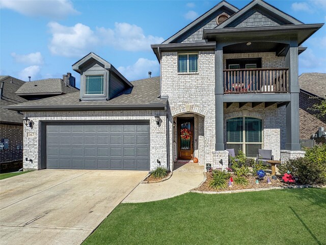 view of front facade with a balcony, a garage, and a front lawn