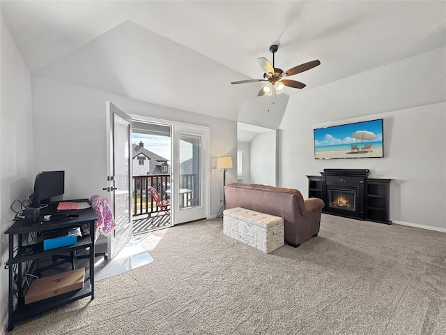 carpeted living room with ceiling fan, a fireplace, and lofted ceiling