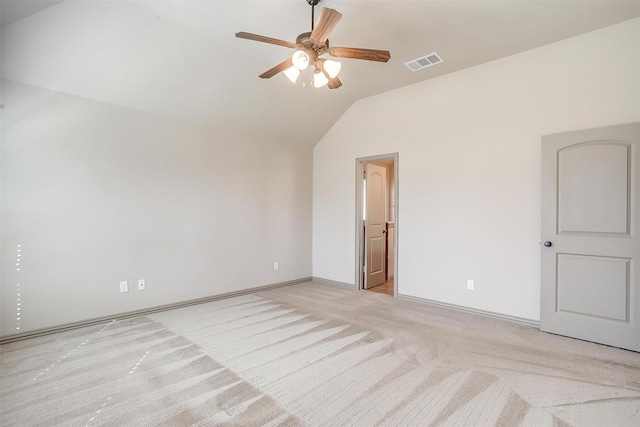 unfurnished room with light carpet, vaulted ceiling, and ceiling fan