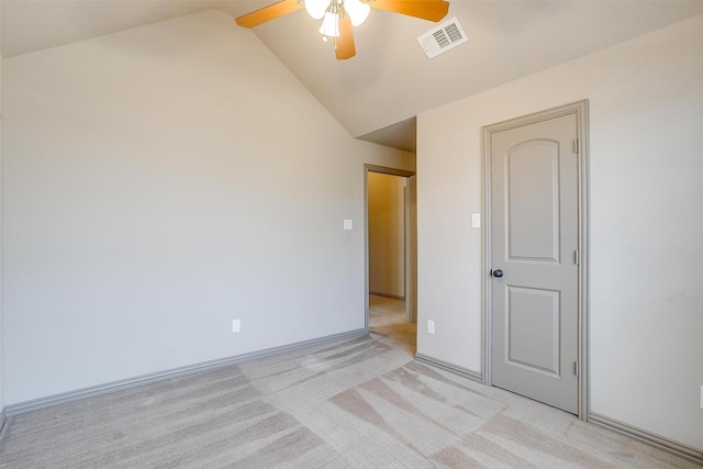 unfurnished room featuring light carpet, ceiling fan, and lofted ceiling