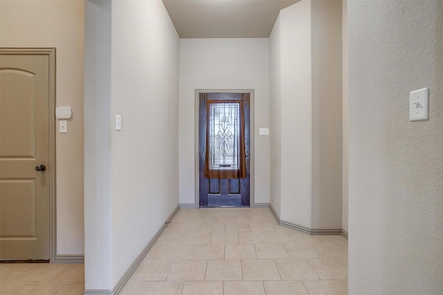 entryway with light tile patterned floors