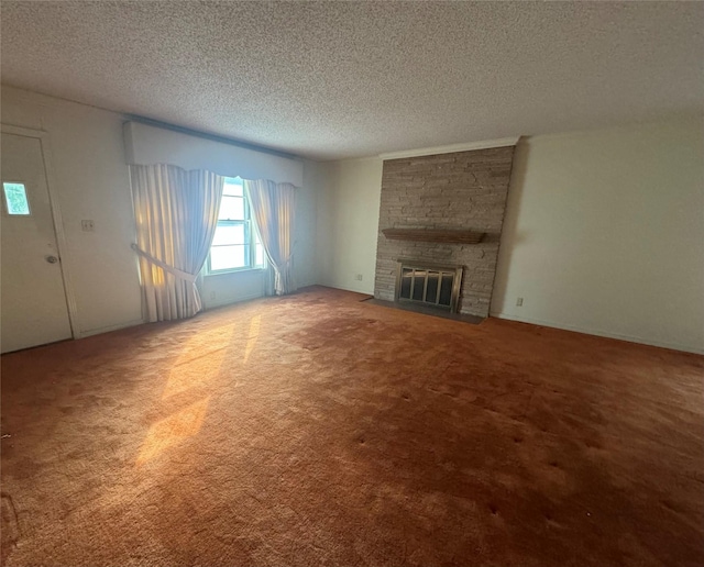 unfurnished living room with carpet, a fireplace, and a textured ceiling