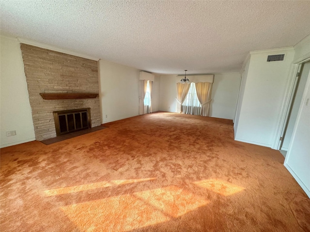 unfurnished living room with a large fireplace, carpet floors, a textured ceiling, and a chandelier