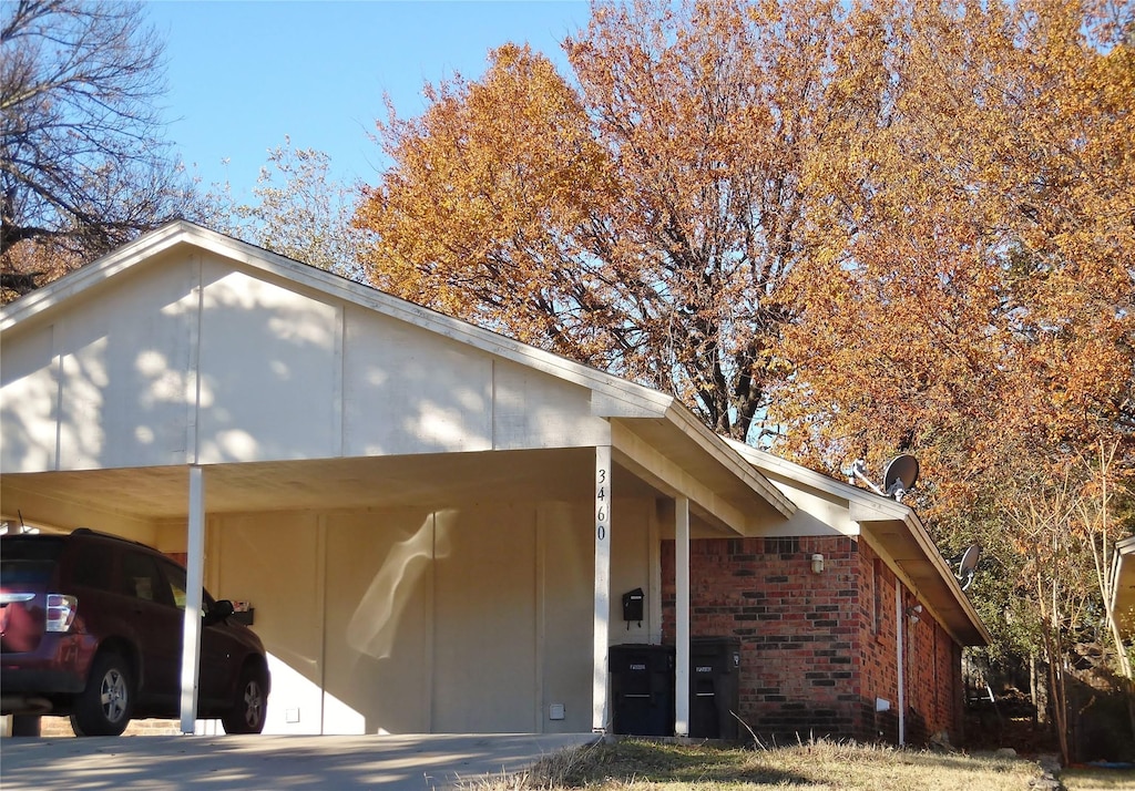 view of side of home featuring a carport