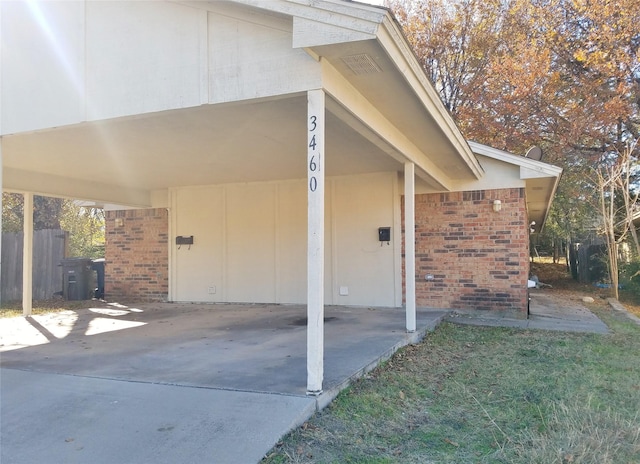 property entrance with a carport