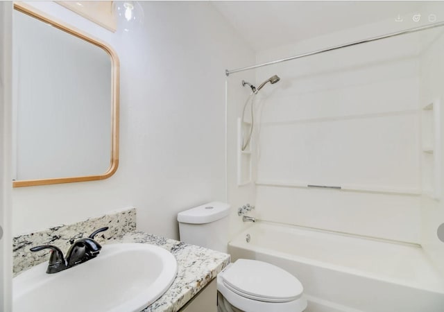 full bathroom featuring vanity, toilet, and washtub / shower combination