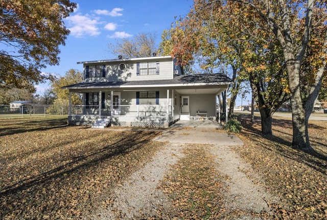 view of front of house featuring a carport and a porch