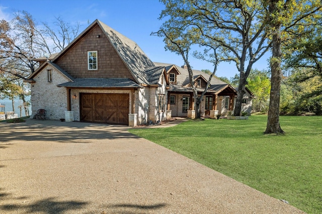 view of front of home featuring a garage and a front lawn