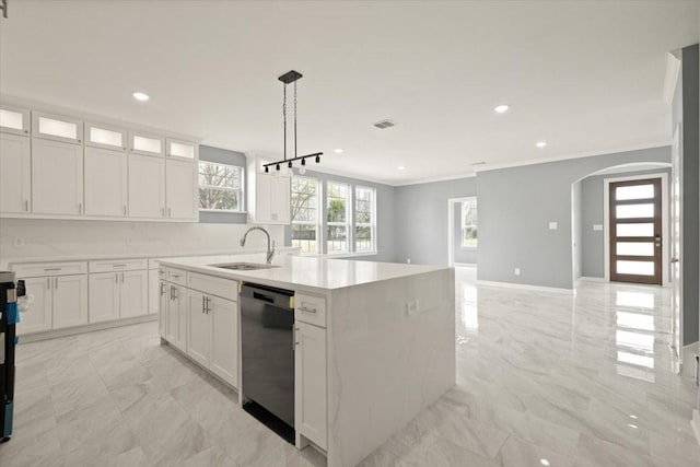 kitchen with arched walkways, marble finish floor, a sink, and dishwashing machine