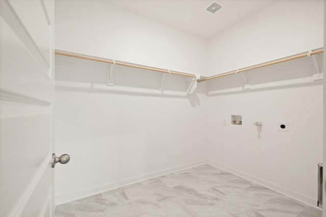 clothes washing area with laundry area, baseboards, washer hookup, and electric dryer hookup