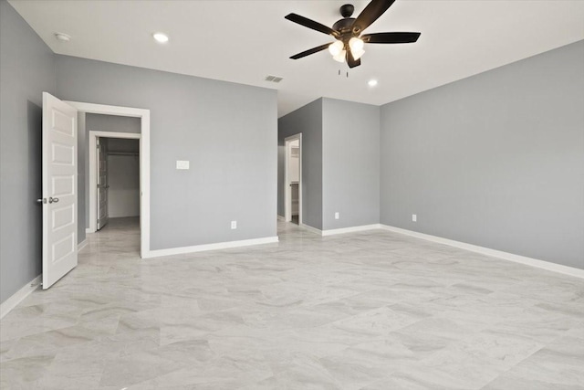 unfurnished bedroom featuring baseboards, visible vents, a walk in closet, and recessed lighting