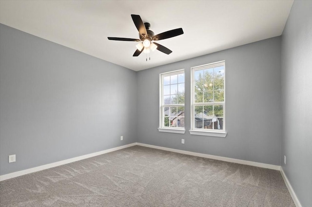 unfurnished room with carpet floors, ceiling fan, and baseboards