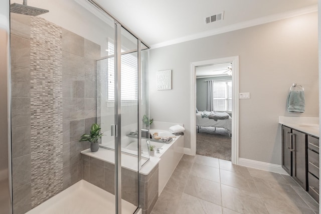 bathroom with tile patterned floors, vanity, ornamental molding, and shower with separate bathtub