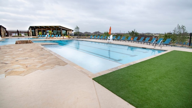 view of pool featuring a patio