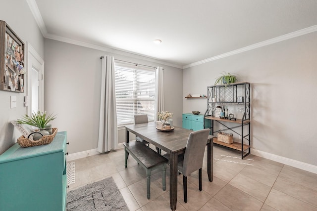 dining room with light tile patterned floors and ornamental molding