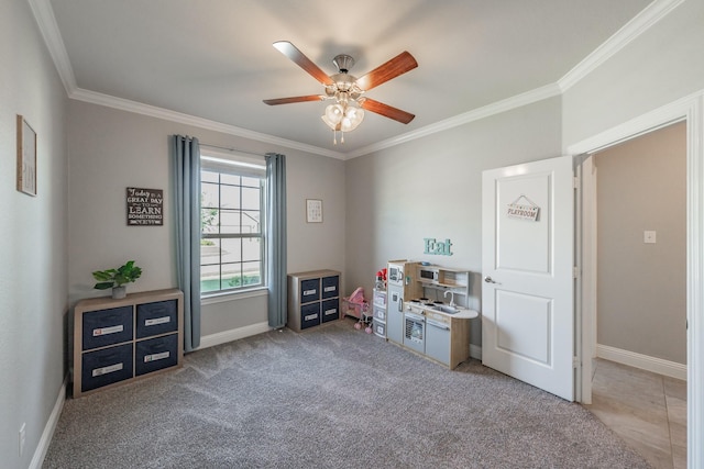 misc room with carpet, ceiling fan, and crown molding