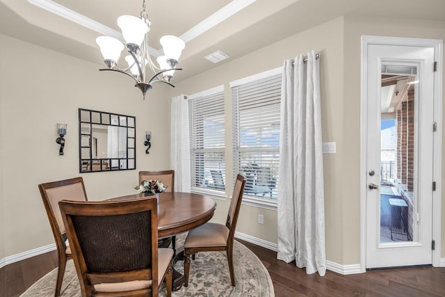 dining space featuring a notable chandelier and dark wood-type flooring